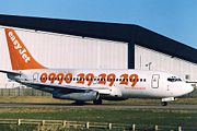 EasyJet Boeing 737-200 sporting the old phone-number livery at London Luton Airport.