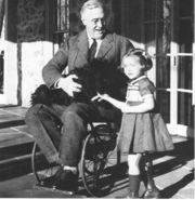 One of only a few known photographs of Roosevelt in a wheelchair.