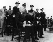 Roosevelt and Winston Churchill meet at Argentia, Newfoundland aboard HMS Prince of Wales during their 1941 secret meeting to develop the Atlantic Charter.