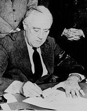 Roosevelt signing the declaration of war against Japan, 8 December 1941.