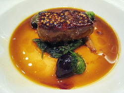 Foie gras with mustard seeds and spring onions in duck jus