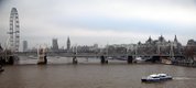 The Thames passes by some of the sights of London, including the Houses of Parliament and the London Eye