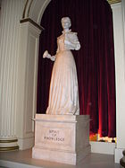 A personification of knowledge as represented by a statue of an early school teacher in The American Adventure in the World Showcase pavilion of Walt Disney World's Epcot.