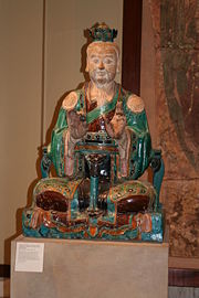 Chinese glazed stoneware statue of a Taoist deity, Ming Dynasty, 16th century.