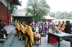 Chinese Taoist priests celebrating a ritual at the Wudangshan monastery
