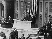 Harding addresses the House of Representatives, Coolidge and Gillett seated behind.