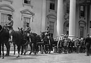 President Harding's casket passes by the front of the White House.