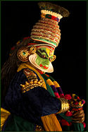 A close-up of a kathakali artist.