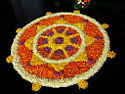During Onam, Keralites create floral pookkalam designs in front of their houses.