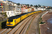In classic HST pose, the Network Rail New Measurement Train heads past Dawlish