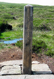 The source of the River Severn on Plynlimon, Wales. The source is marked with this post in both English and Welsh.