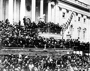 The only known photographs of Lincoln giving a speech were taken as he delivered his second inaugural address. Here, he stands in the center, with papers in his hand.