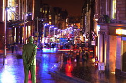 Buchanan Street at night, looking southward behind the Donald Dewar statue.