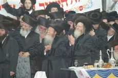 Hasidic Jews wearing black frock coats and fur shtreimels