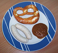 Weißwürste with sweet mustard and a Breze (pretzel).