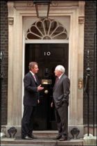 Tony Blair and Dick Cheney at the main door to 10 Downing Street, the Prime Minister's residence in London, on 11 March 2002.