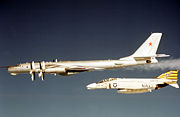 United States Navy F-4 Phantom II intercepts a Soviet Tu-95 Bear D aircraft in the early 1970s
