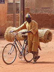 A man uses a bicycle to cargo goods in Ouagadougou, Burkina Faso (2007)