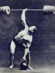 An early plate-loading barbell and kettlebell