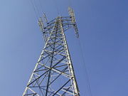 A steel pylon suspending overhead powerlines.