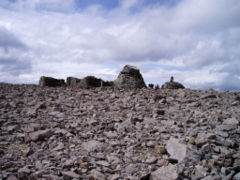 The summit plateau. The ruined observatory is in the centre, with the summit cairn to the right.