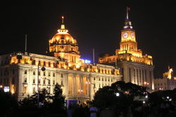The Hongkong and Shanghai Banking Corporation building on The Bund (with the round dome, currently houses the Shanghai Pudong Development Bank).