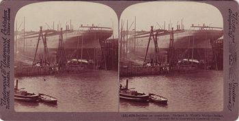 A 1907 stereoscope postcard depicting the construction of a liner at the Harland and Wolff shipyard.