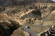 A highway through mountainous landscape in Ladakh.
