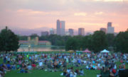 The Denver skyline from City Park during a free summer jazz concert, looking west