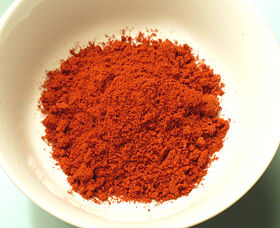 A small bowl of hot smoked Spanish paprika