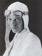 Studio portrait of Amelia Earhart, c. 1932. Putnam specifically instructed Earhart to disguise a "gap-toothed" smile by keeping her mouth closed in formal photographs.
