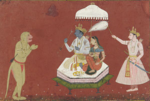 Rama seated with Sita, fanned by Lakshamana, while the monkey-god Hanuman pays his respects.