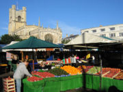 The market in the centre of Cambridge, with Great St Mary's Church in the background · more