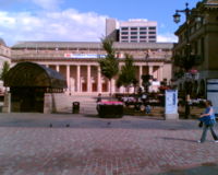 Dundee City Square. The building at the back of the square is Caird Hall. The building on the right is Dundee City Chambers, where the city council meets