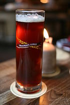 German dunkel beer served in a branded glass.