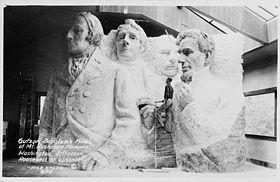 A model at the site depicting Mount Rushmore's intended final design.  Insufficient funding forced the carving to end in October 1941.