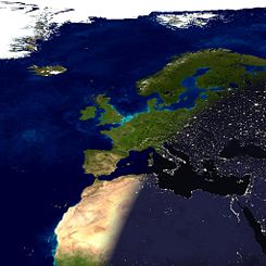 A composite image showing the terminator dividing night from day, running across Europe and Africa. Observers on the surface of the earth along this terminator will see a sunset.