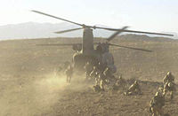 Soldiers board a Chinook in Operation Anaconda.