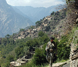A soldier from 10th Mountain Division, patrols Aranas, Afghanistan.