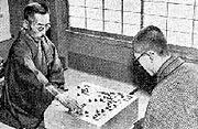 Honinbo Shusai (left), last head of house Honinbo, plays against then-up-and-coming Go Seigen in the game of the century.