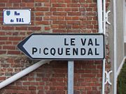 A streetsign in Merck-Saint-Liévin, Pas-de-Calais, showing Germanic influence in local toponyms. The name Picquendal corresponds to the modern Dutch Pikkendal.