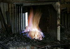 A blacksmith's fire is used primarily for forging iron.