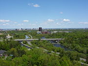 In view: the Rideau Canal, the Rideau River, Colonel By Drive, Carleton University, Downtown Ottawa and the Laurentian mountains