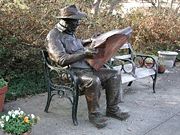 Reading the newspaper: Brookgreen Gardens in Pawleys Island, South Carolina, United States.