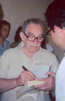 The Colombian García Márquez signing a copy of One Hundred Years of Solitude in Havana, Cuba.