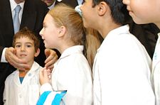 The ubiquitous white uniform of children at public schools is a national symbol of learning.