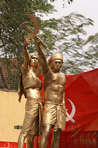 A tableaux in a communist rally in Kerala, India showing two farmers forming the hammer and sickle, the most famous communist symbol.