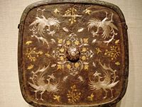 A square bronze mirror with a phoenix motif of gold and silver inlaid with lacquer, 8th century