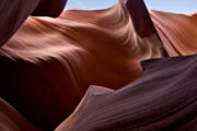 Lower Antelope Canyon was carved out of the surrounding sandstone by both mechanical weathering and chemical weathering.  Wind, sand, and water from flash flooding are the primary weathering agents.