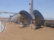 Several of the spare propeller blades mounted on the foredeck